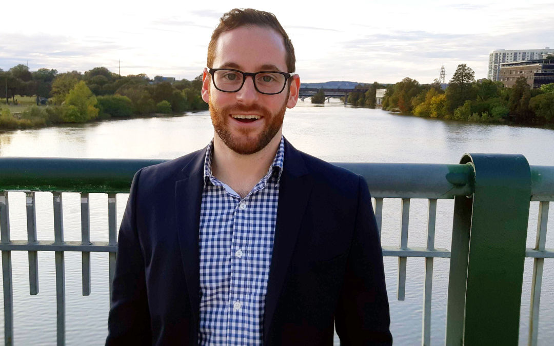 Portrait of Jonathan Houle, ecobee product marketing manager, on a bridge over the Colorado River in Austin, Texas.