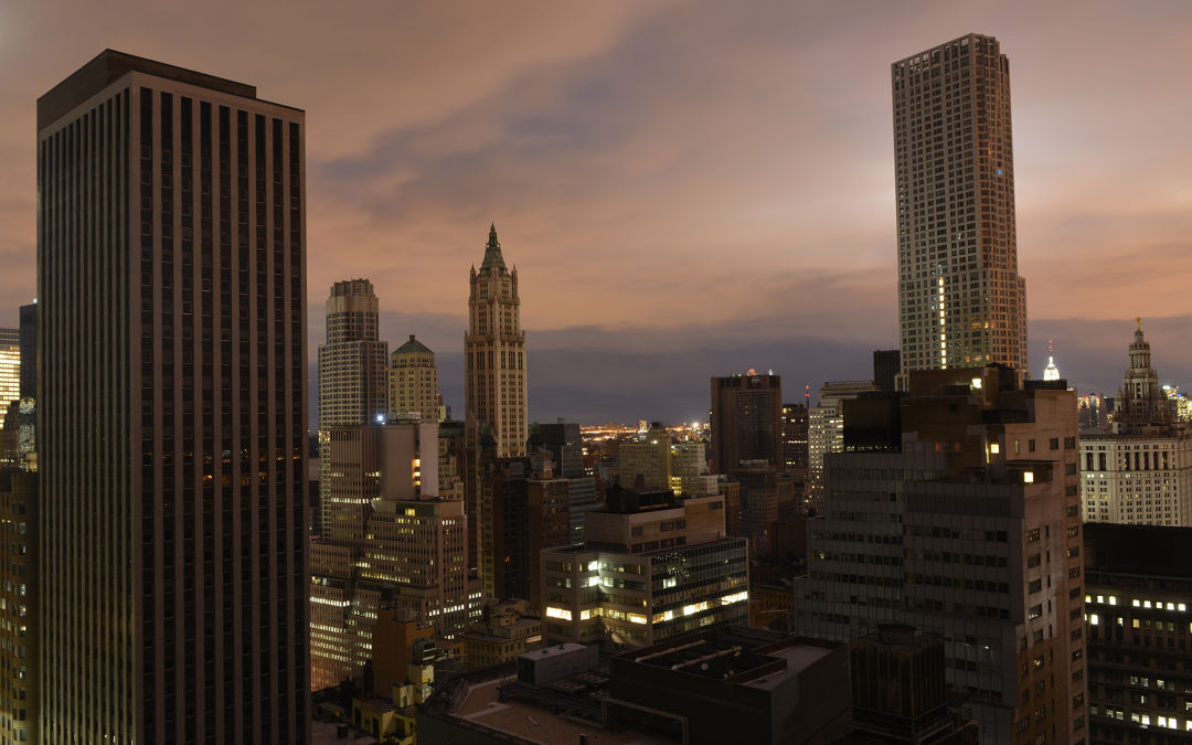 Aerial view of New York City skyline during a blackout. eco+ Community Energy Savings helps you help power grid operators maintain grid stability in times of peak energy demand. 