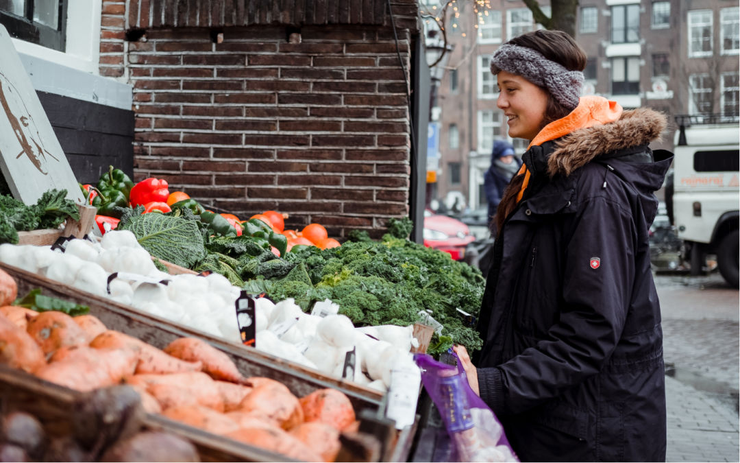 Woman at a produce stand.