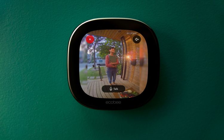 Thermostat view of ecobee doorbell camera. A person is standing outside of front door.