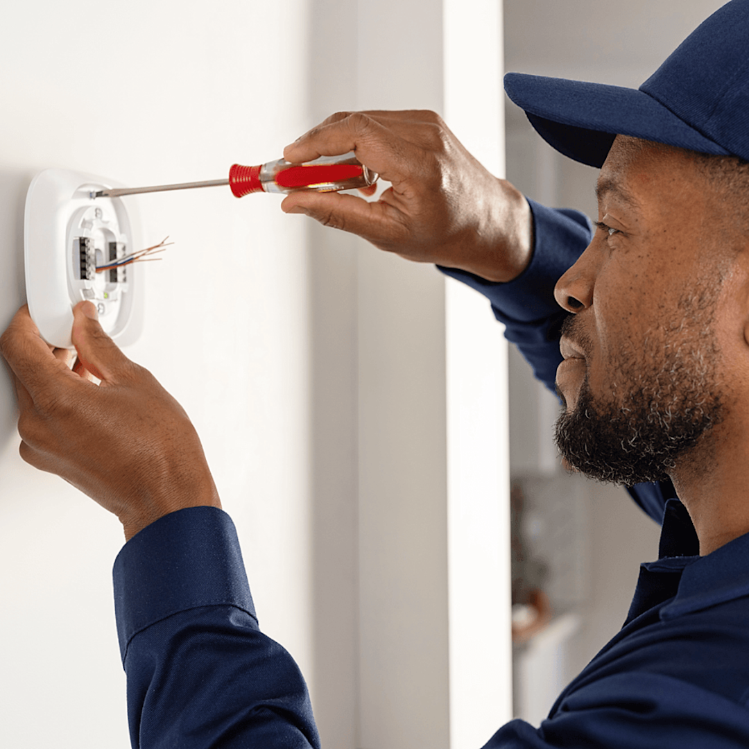 HVAC technician installs ecobee thermostat