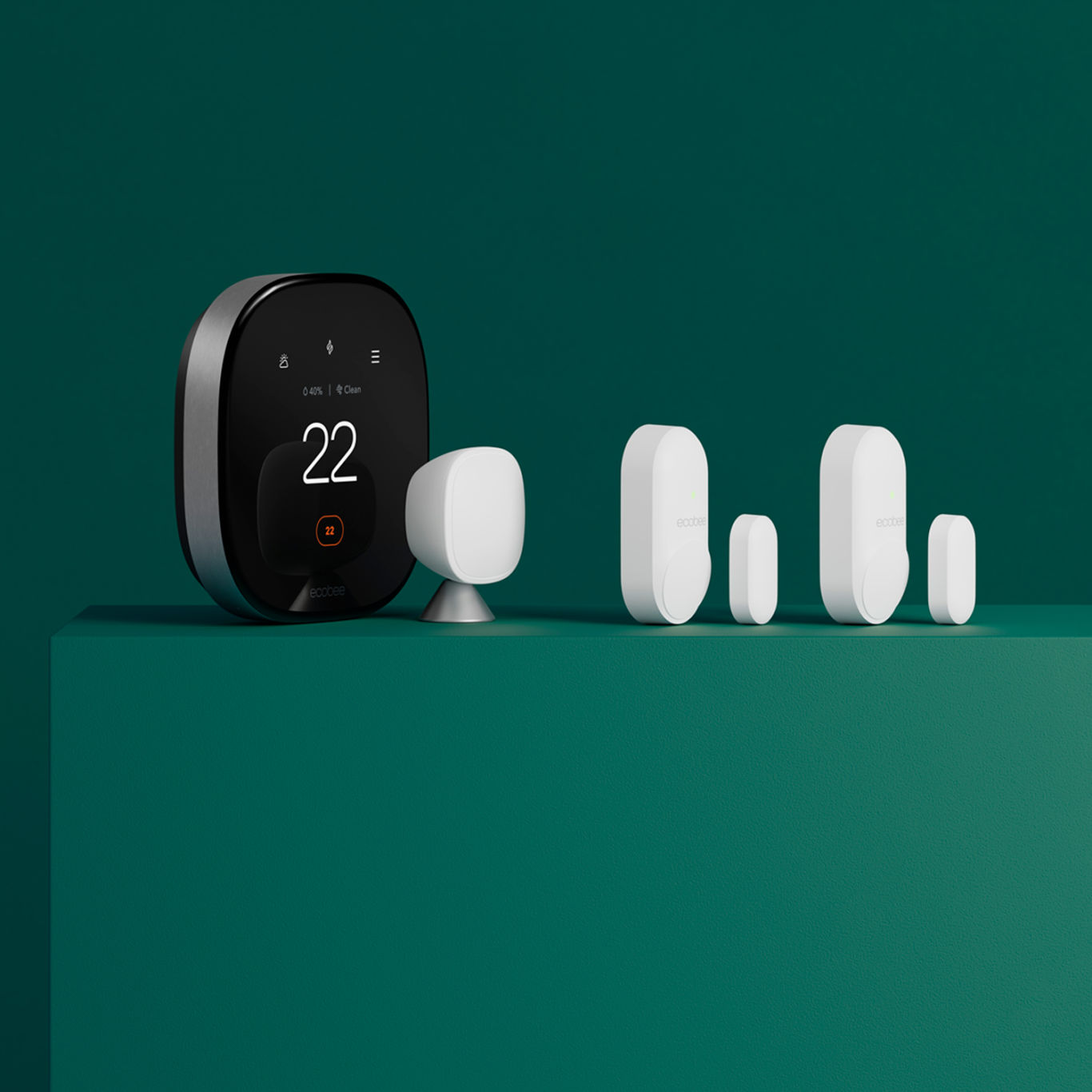 ecobee smart thermostat premium with smartsensors for doors & windows on a green background