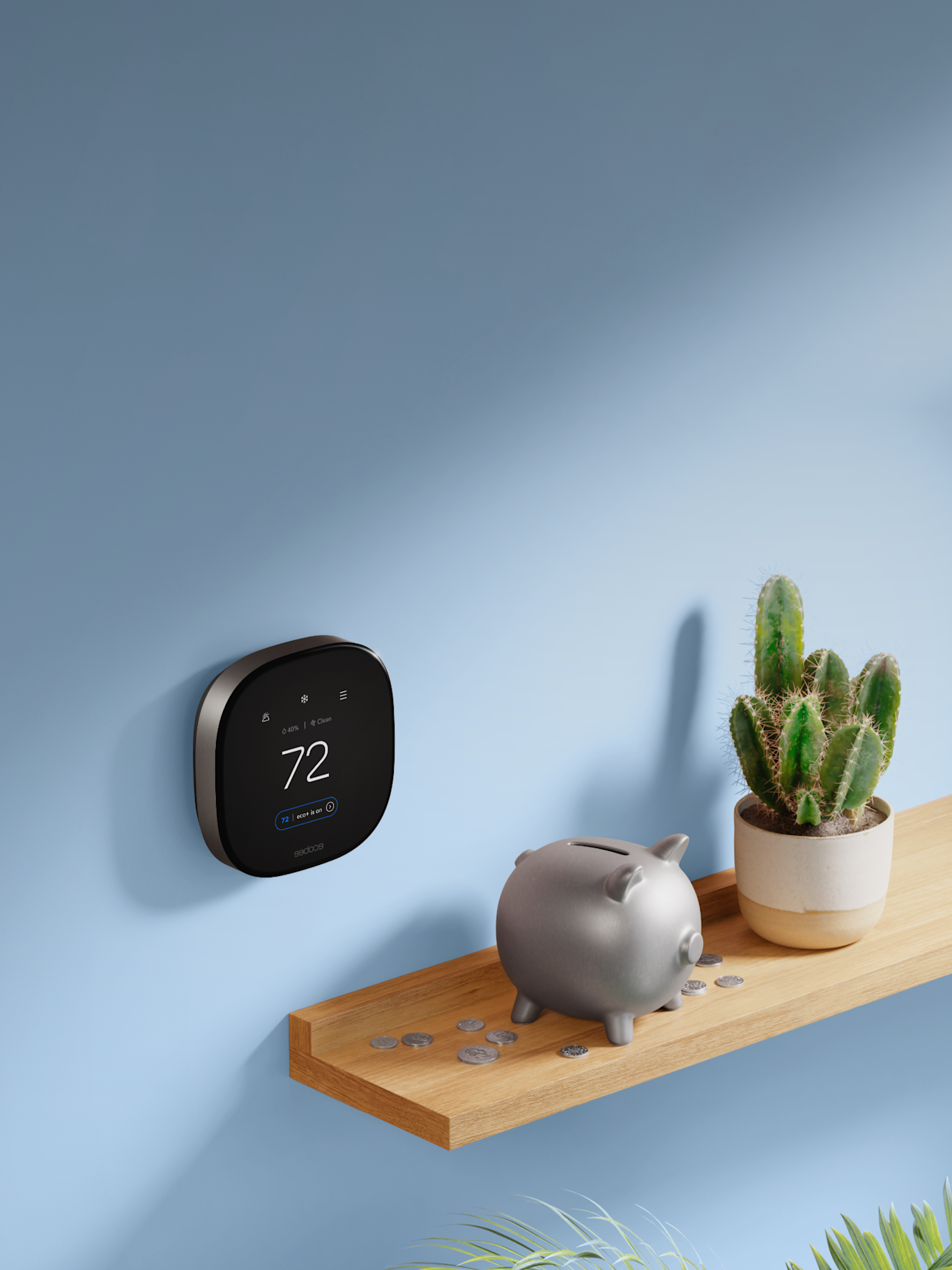 ecobee thermostat on a wall with a shelf that has a piggy bank