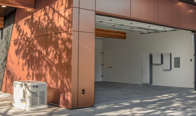 exterior of a garage with a generac generator and EV chargers