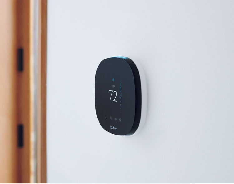 An ecobee SmartThermostat mounted on a wall.