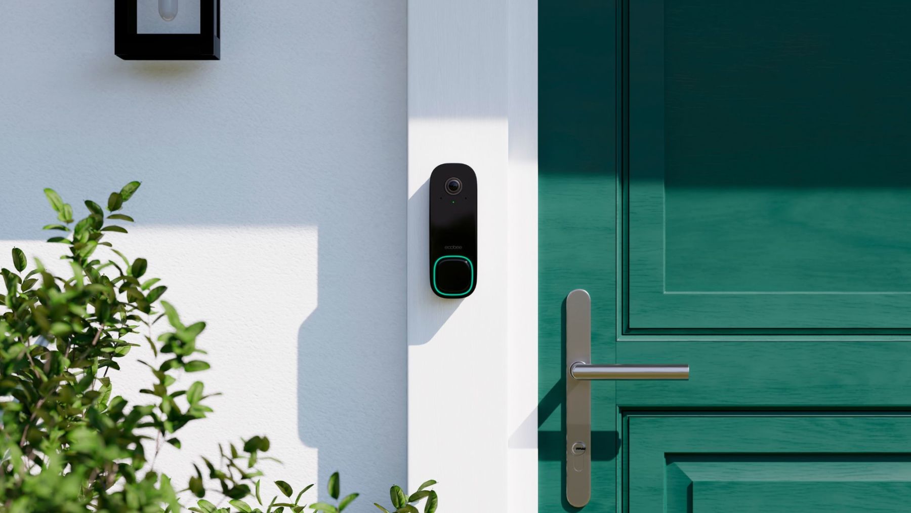 View of ecobee's doorbell camera installed beside a green front door on a white house. 