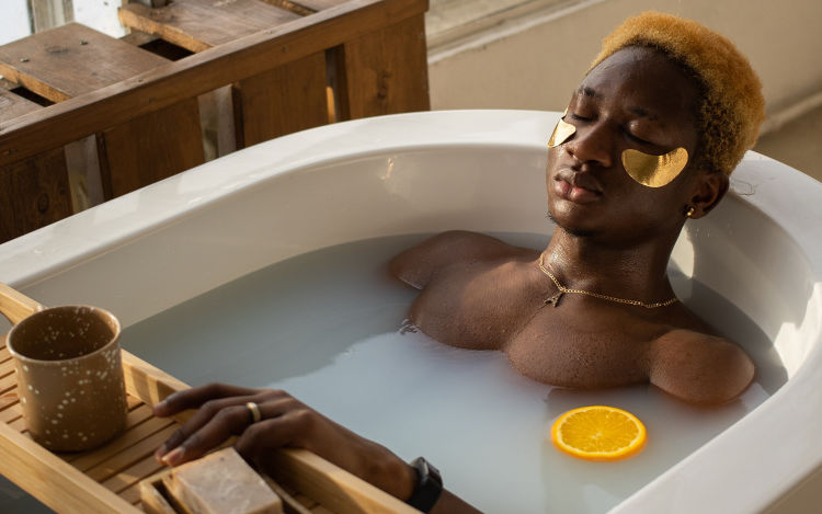 Image of someone relaxing in the bath.