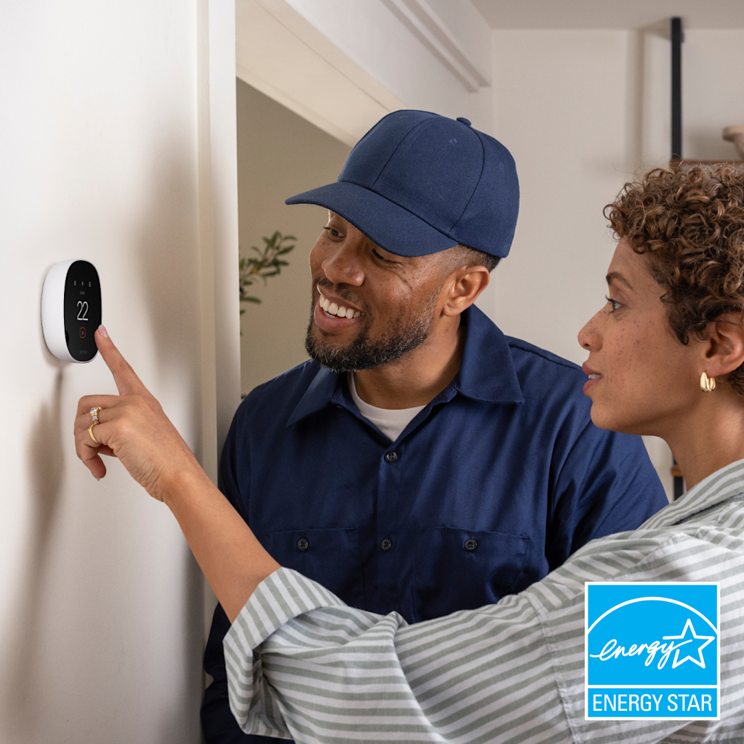 HVAC technician shows homeowner how to use an ecobee thermostat