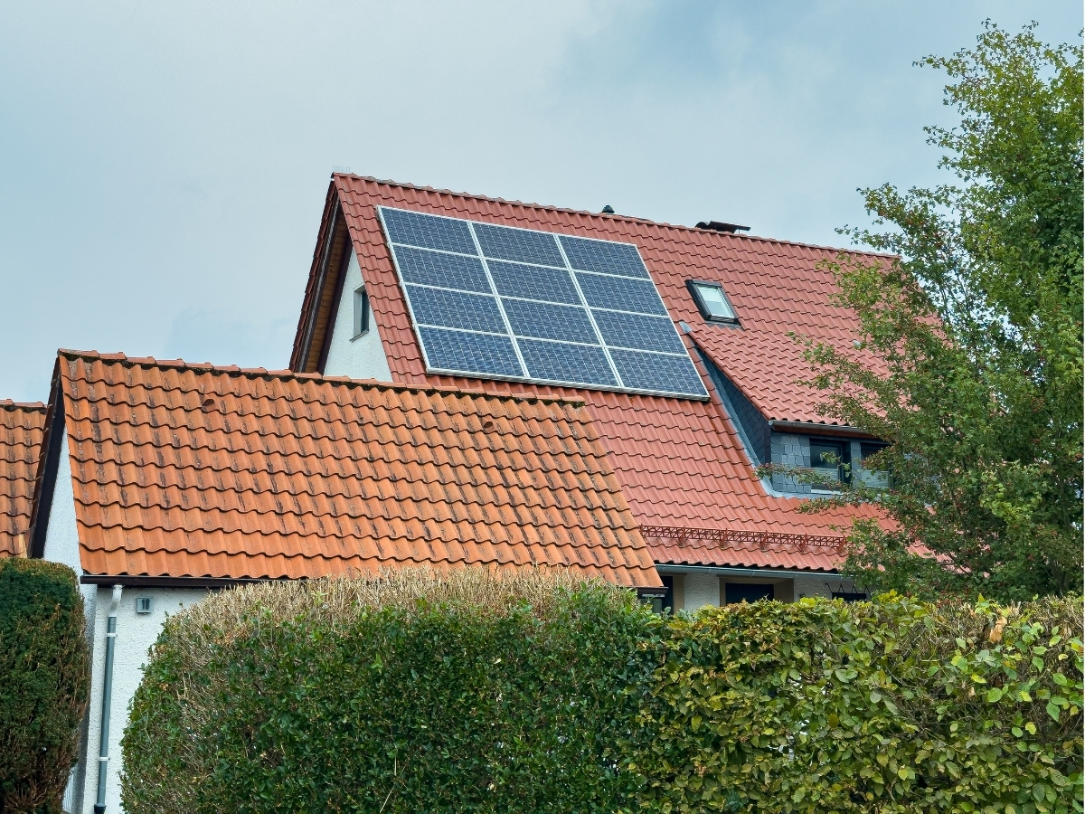 Solar panels on terracotta roof.