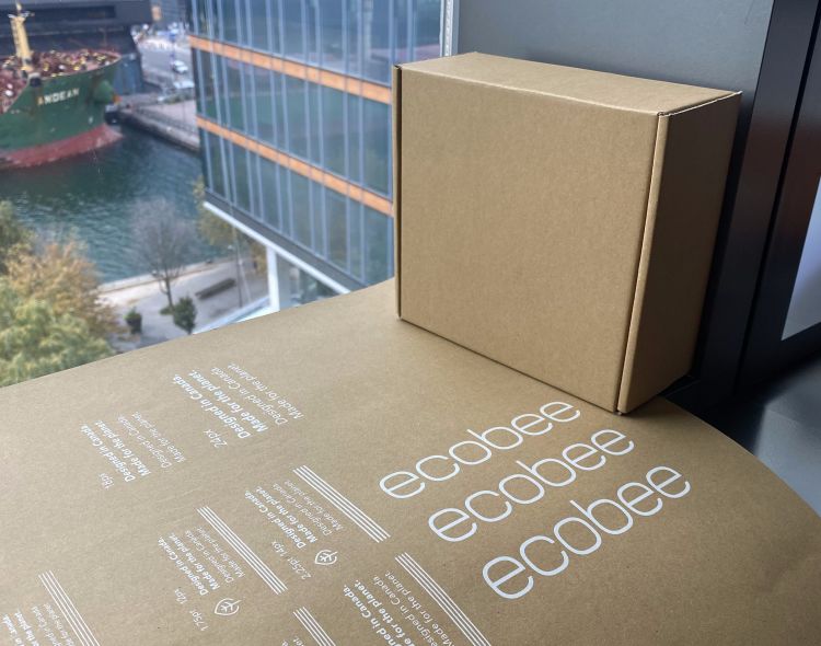 ecobee brown packaging sitting at a window of an office building.