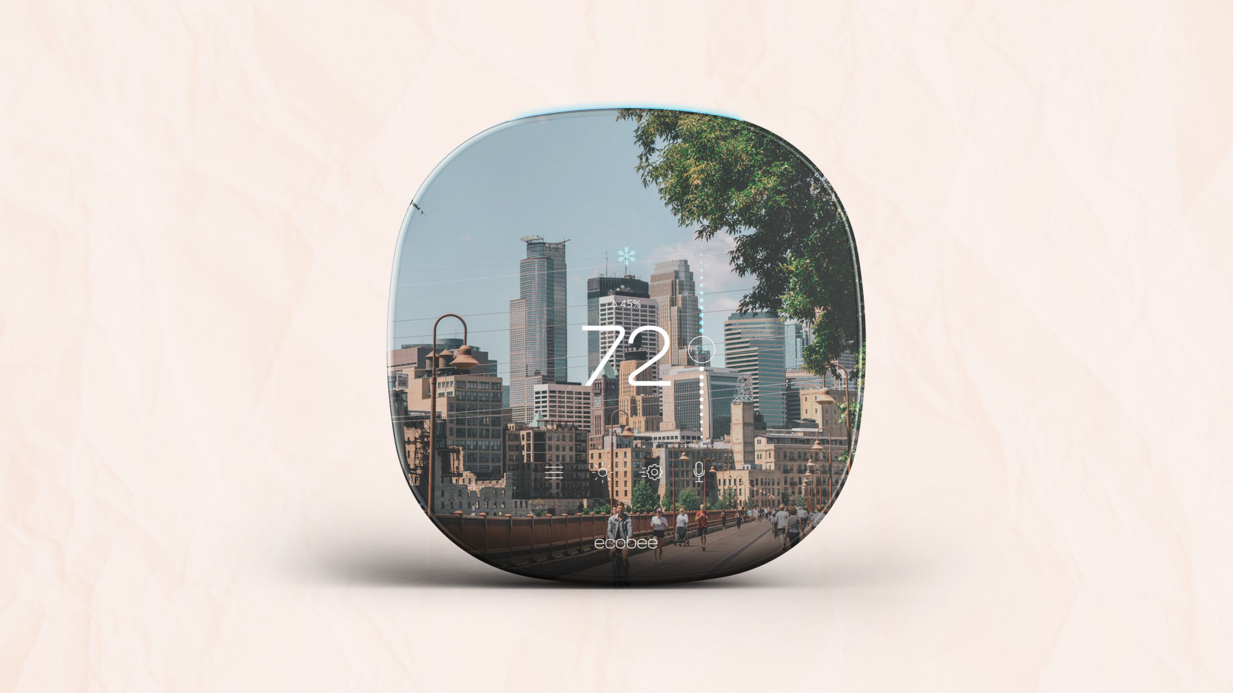 City skyline scene inlaid on an ecobee thermostat on soft pink paper background.
