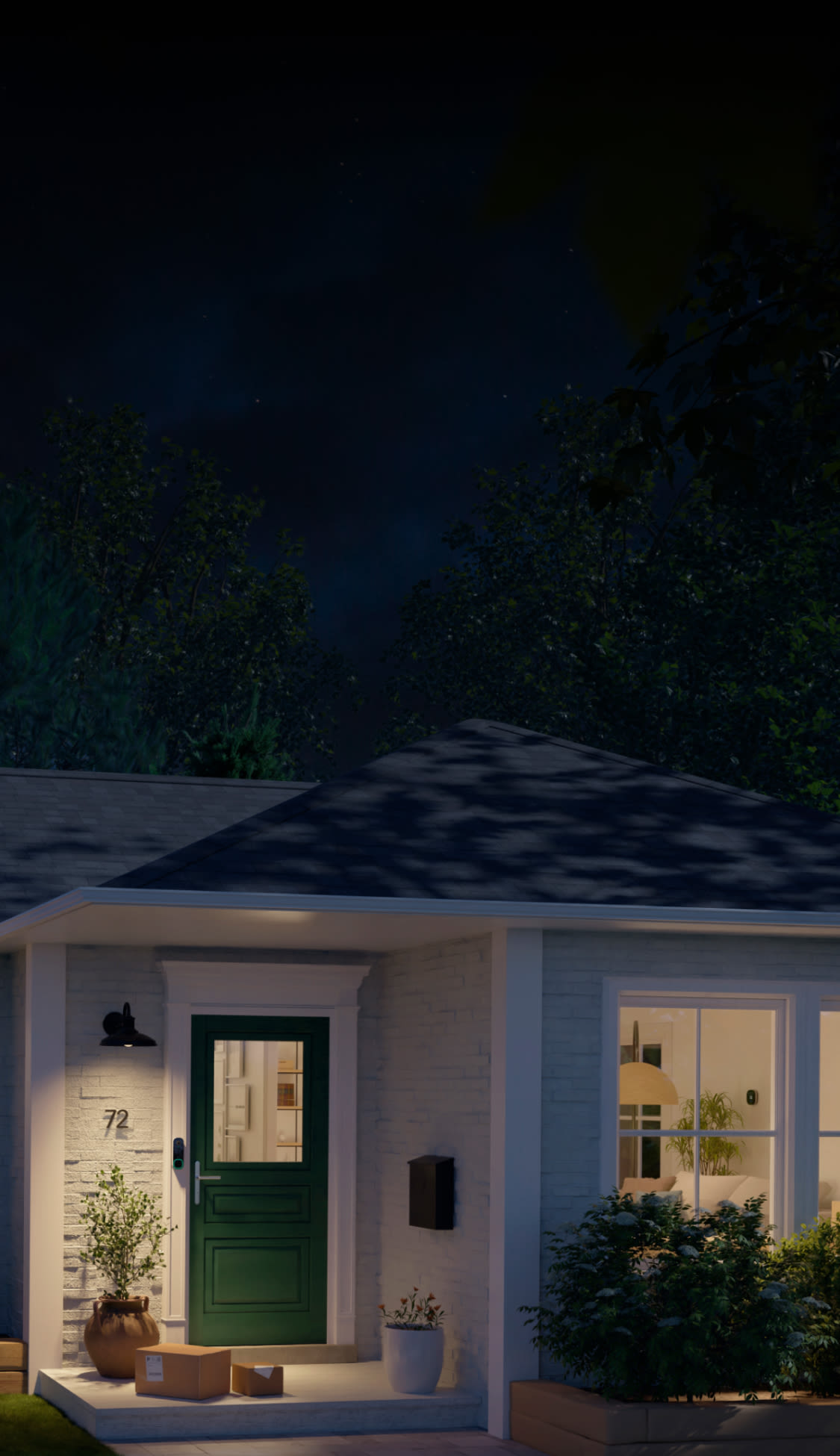 the front porch of a house lit up at night with ecobee smart doorbell camera next to the front door. there are packages on the front step.