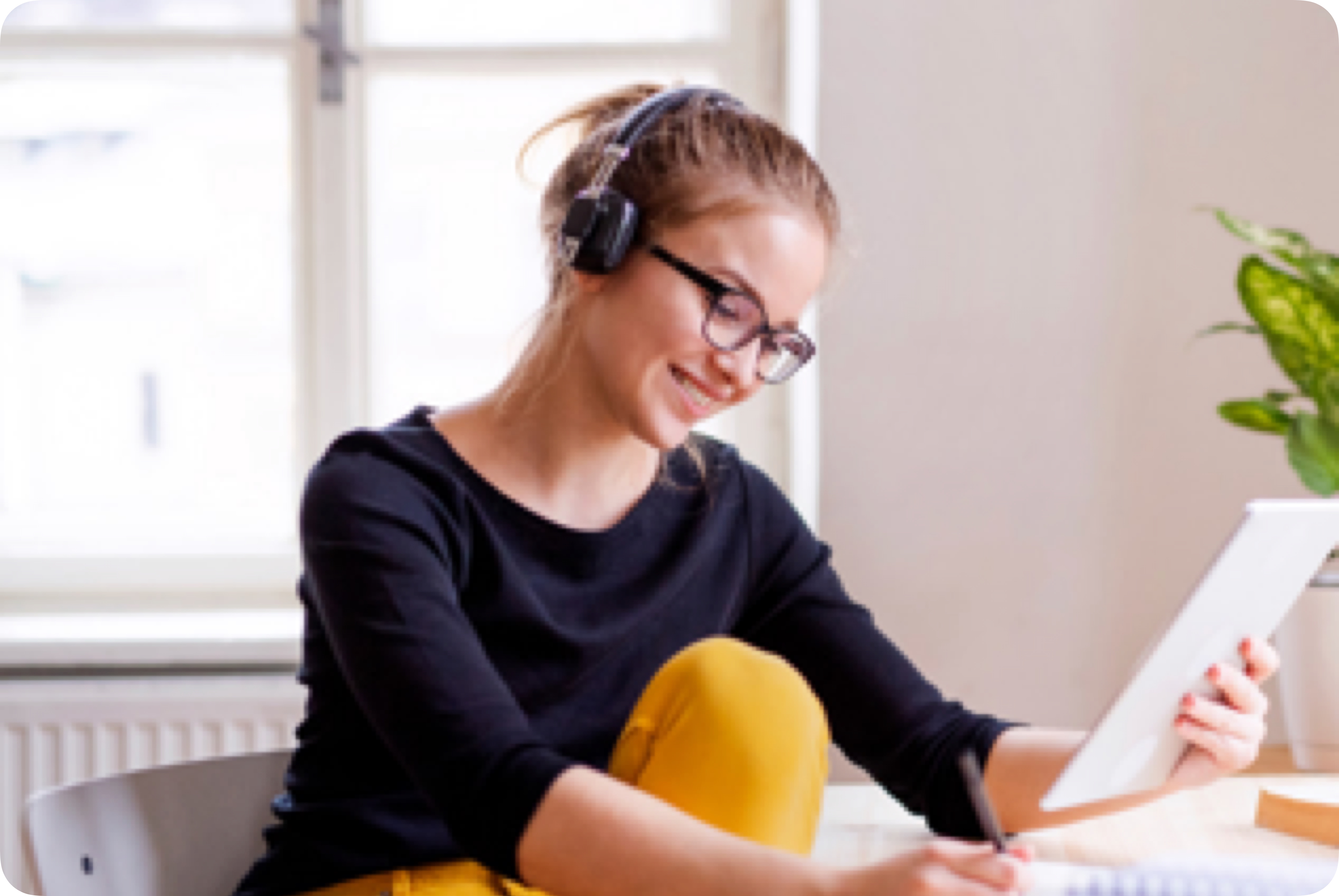 A woman sits at a desk doing homework