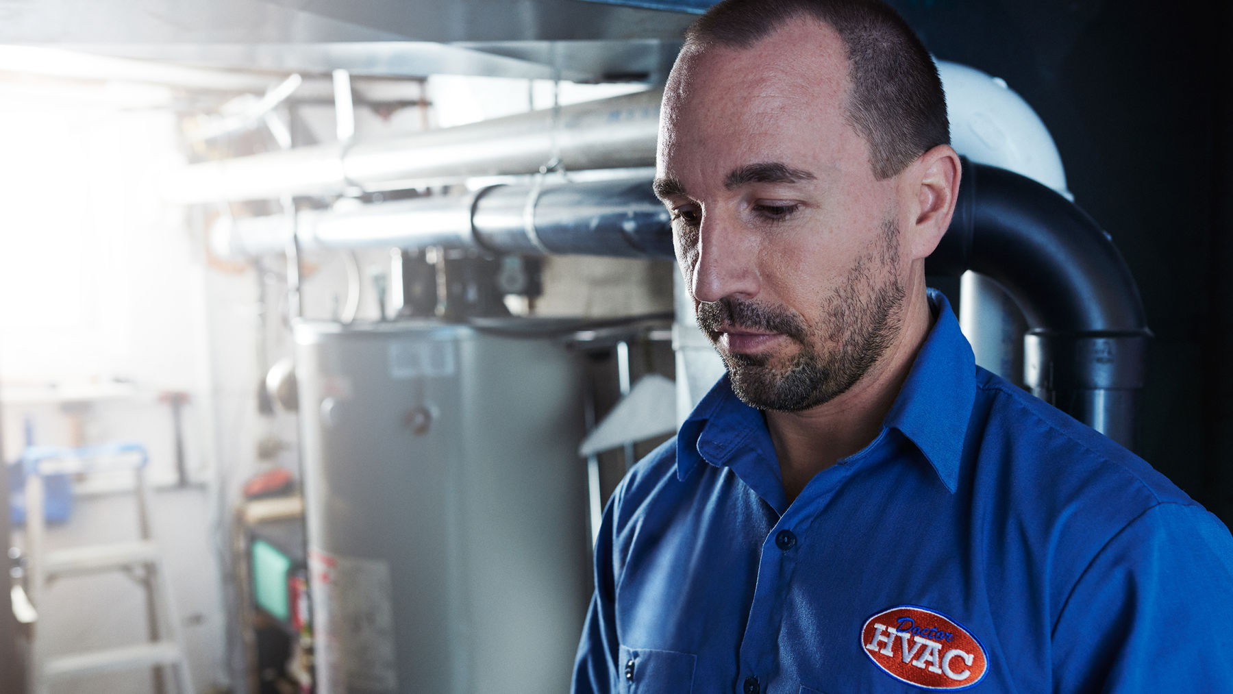 ecobee-trained technician Brandon Aldridge inspects customers HVAC system 