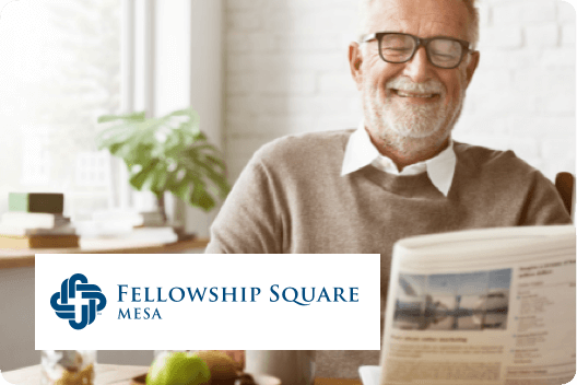 A man reads the newspaper with a logo for Fellowship Square Mesa overlaid.