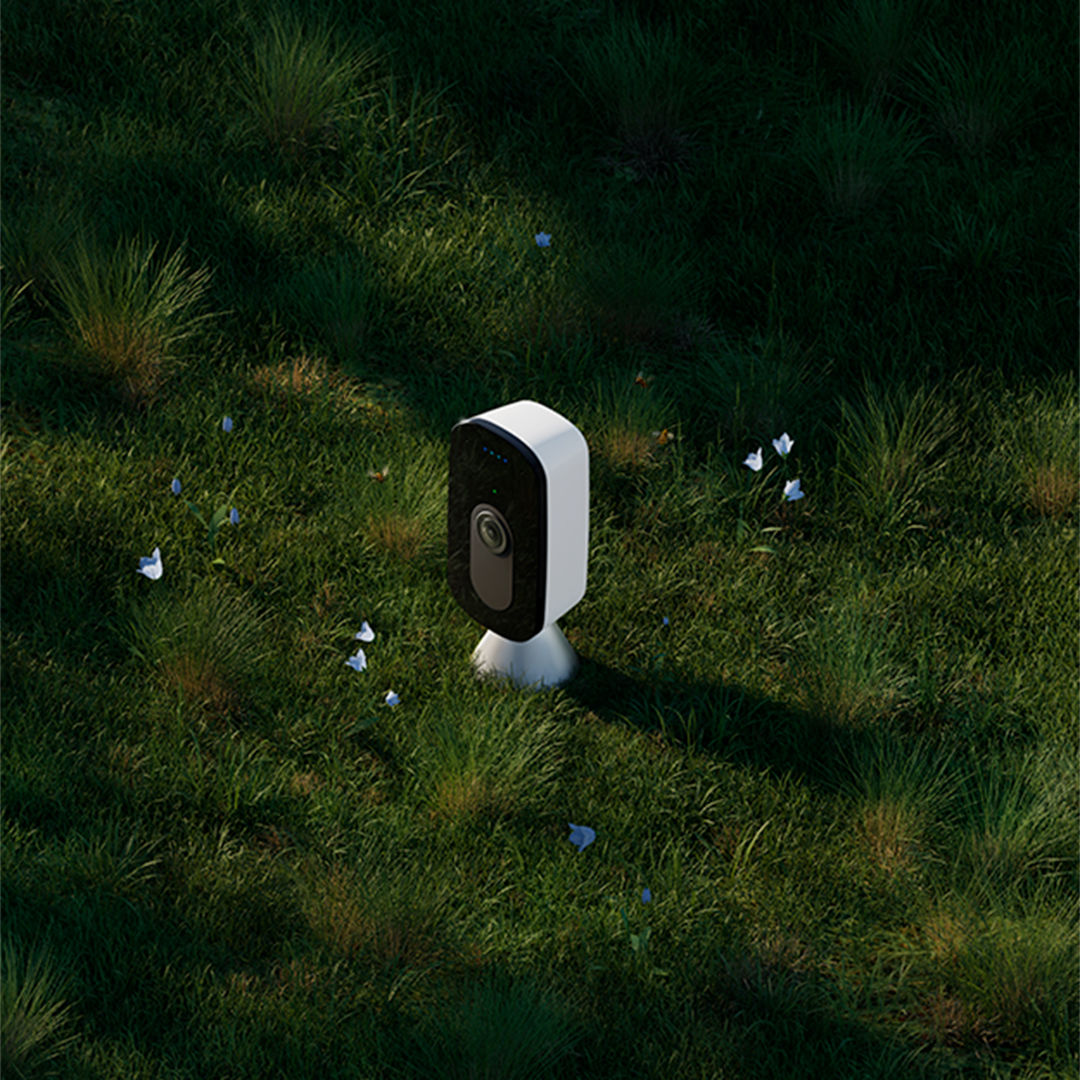 ecobee smartcamera with voice control on a bed of grass and flowers