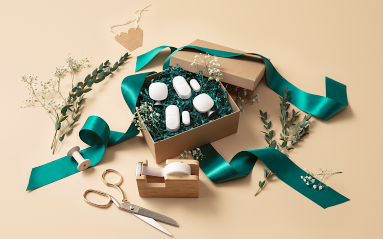 ecobee's SmartSensors presented in a brown gift box and green ribbon with holiday packaging