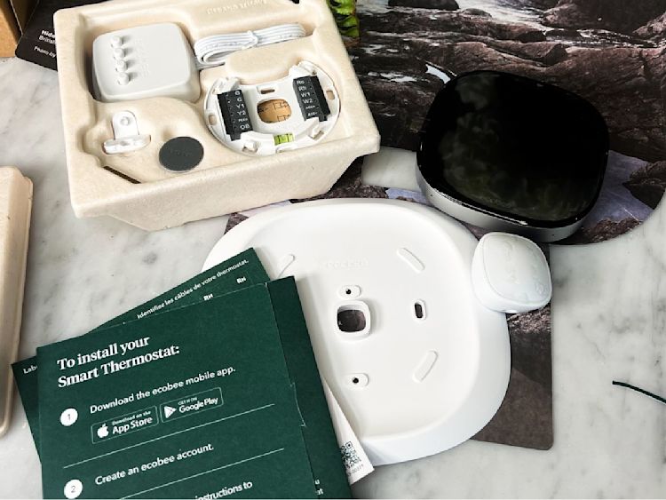 ecobee's Smart Thermostat Premium packaging, displaying the Smart Thermostat Premium and all installation components.