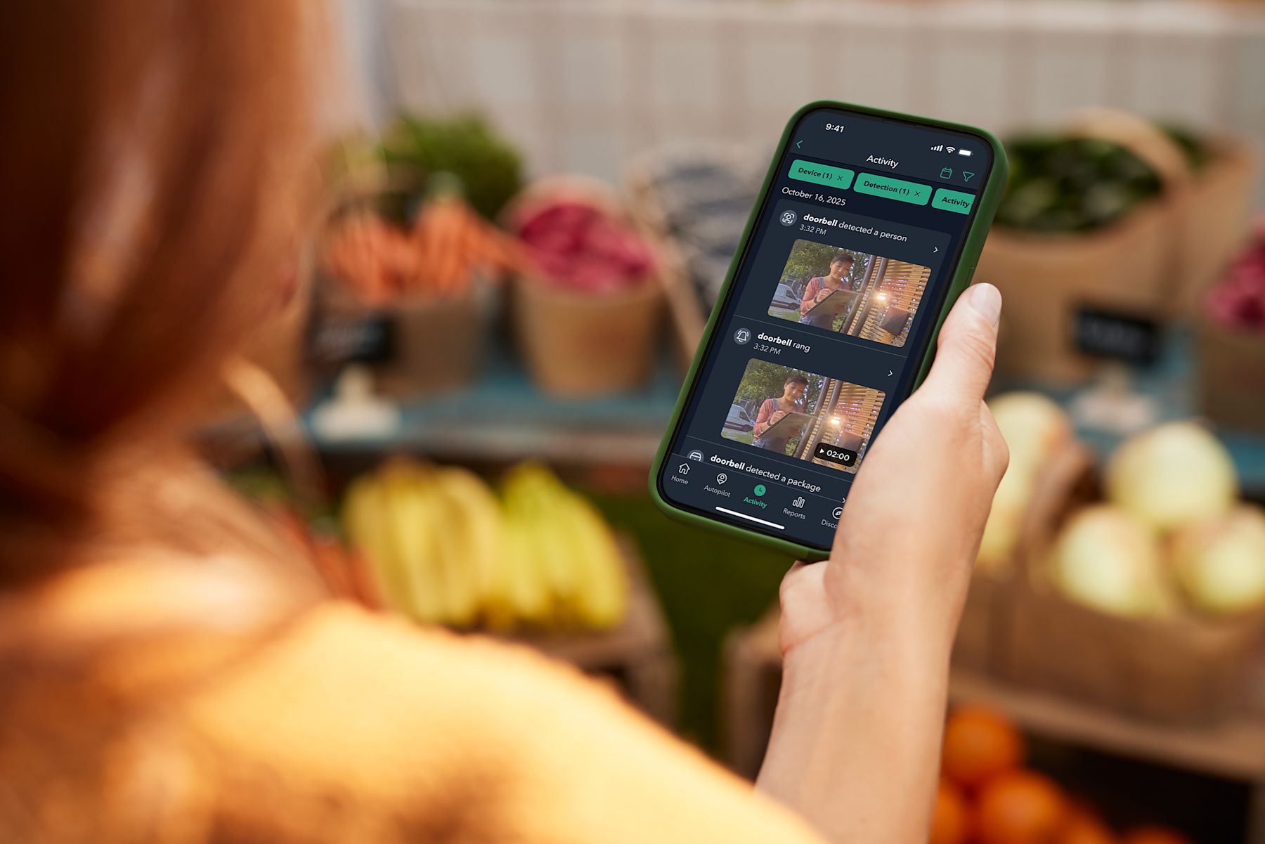 Woman reviewing ecobee Smart Security Activity Feed.