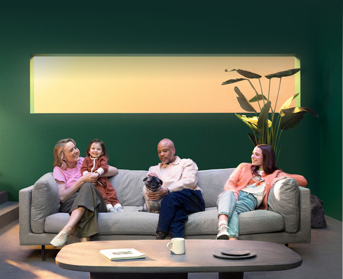 A family sits in a living room with ecobee products.