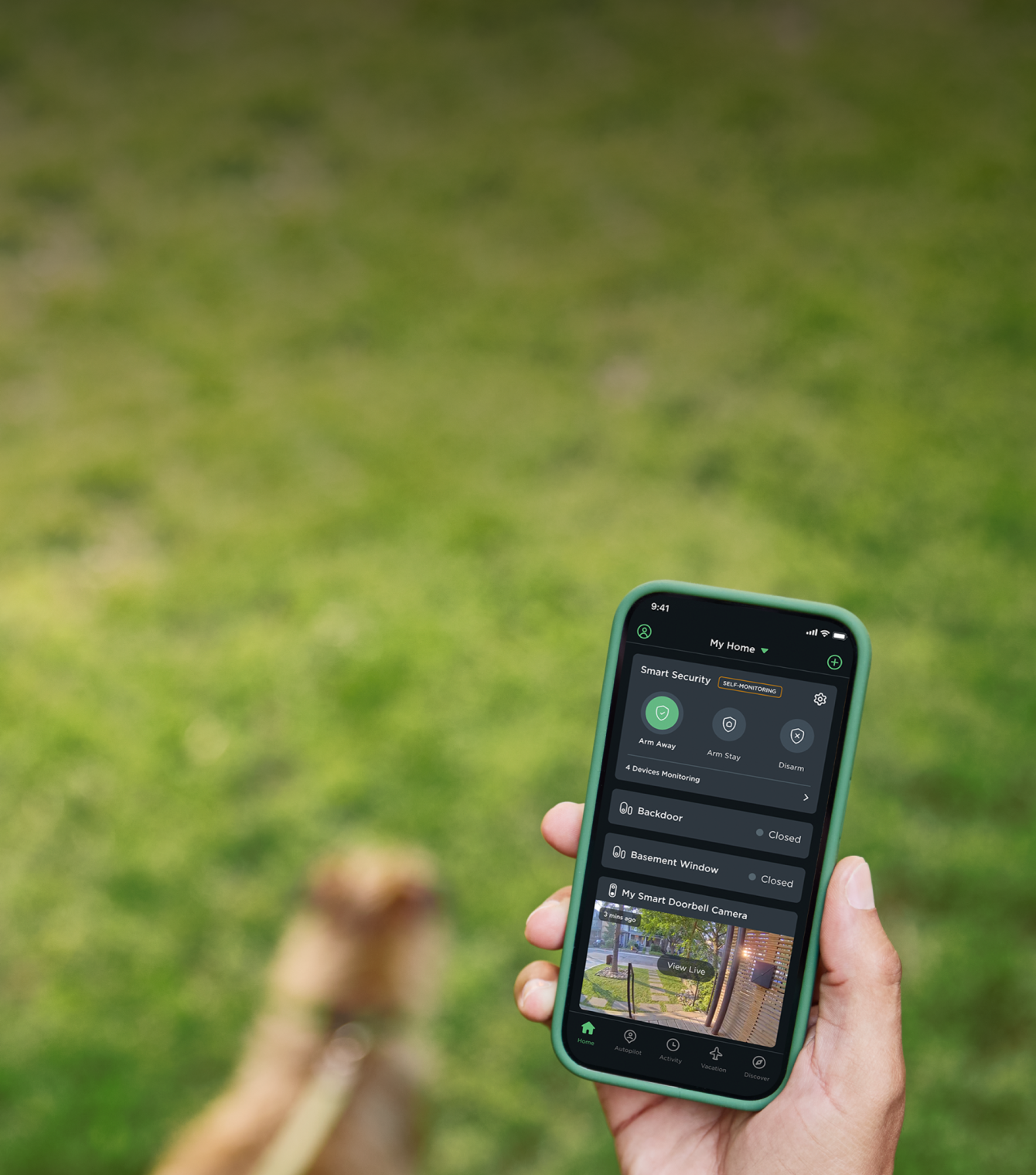 A person holding their phone while walking their dog. Their phone screen shows ecobee's app.