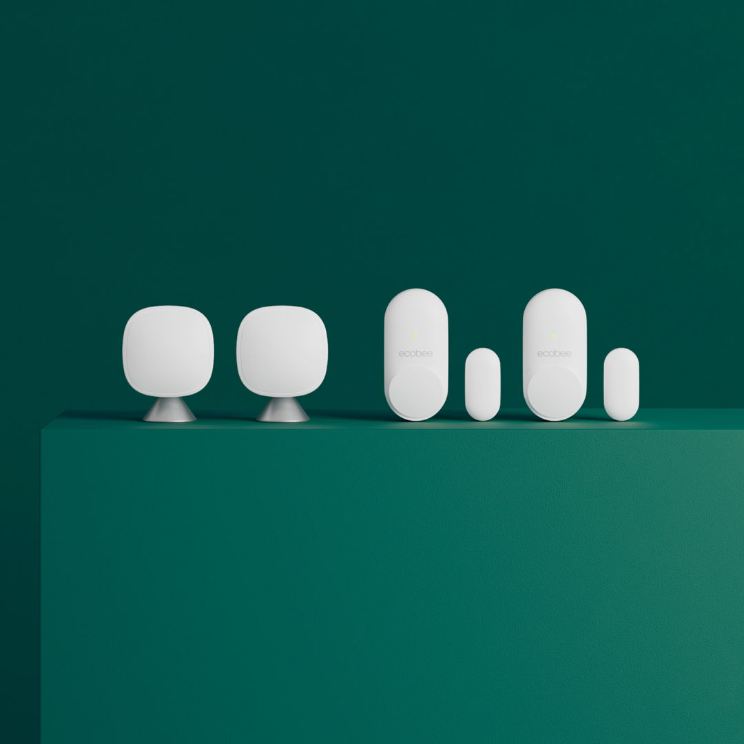 A set of Smart Sensors for Doors and Windows and a set of SmartSensors on a green background.