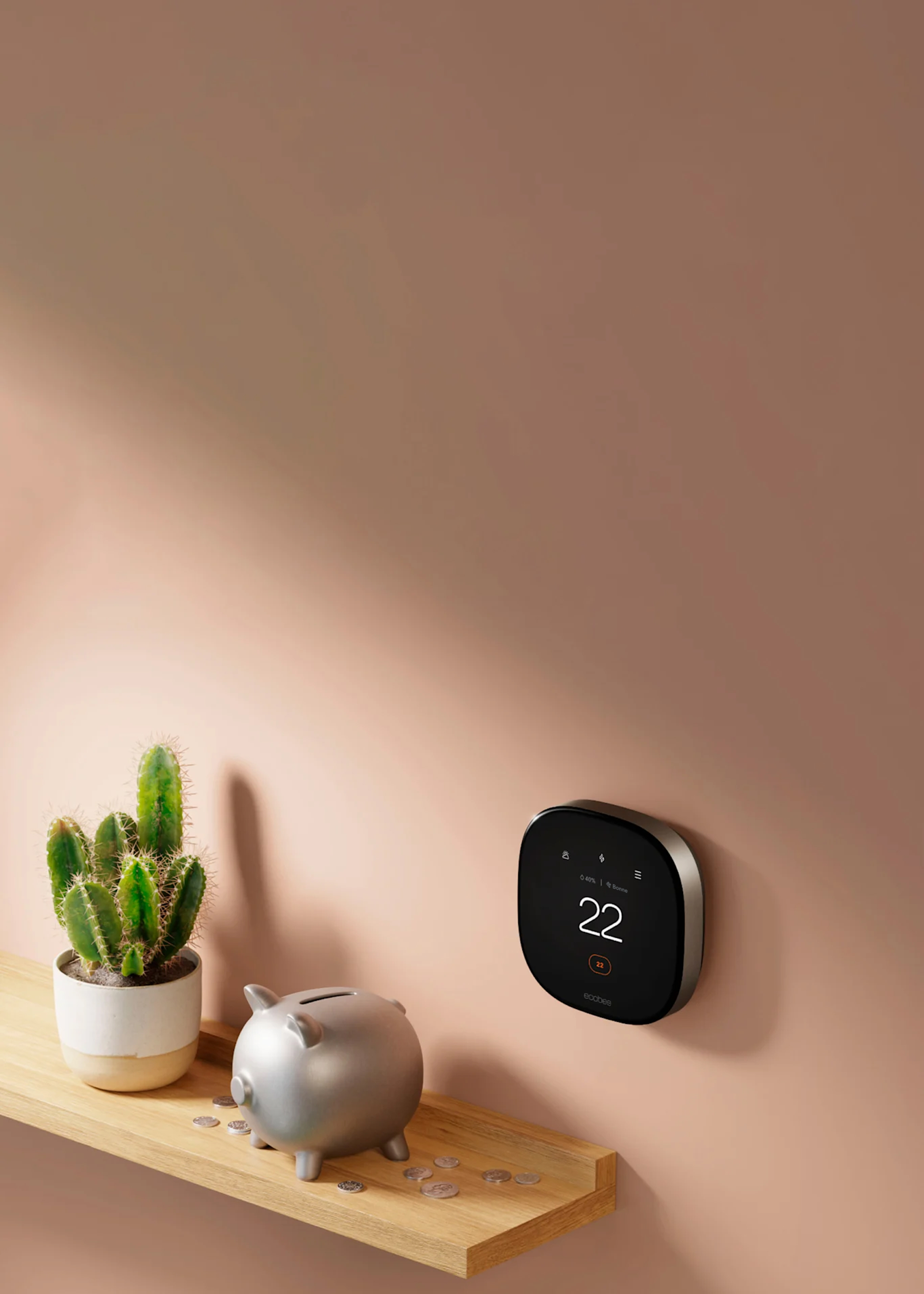 thermostat ecobee sur un mur à côté d'une tirelire sur une étagère