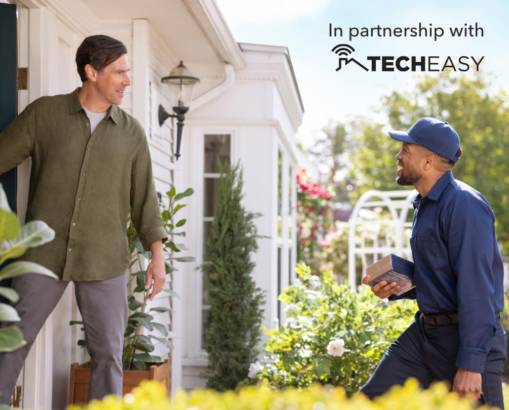 a professional installer arrives to a house holding an ecobee smart doorbell camera - the text "in partnership with techeasy" is at the top