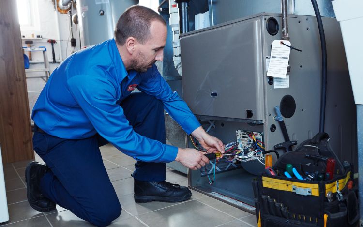 Contractor performs maintenance on furnace