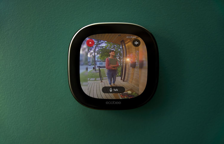 Live view of delivery person from Smart Doorbell Camera on Smart Thermostat Premium.