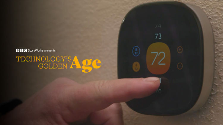 Documentary subject John Marlatt adjusts the temperature on his ecobee smart thermostat. 