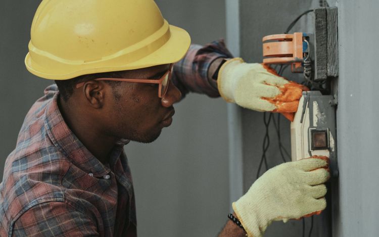 A technician working out the loading calculation