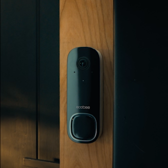 ecobee Smart Doorbell Camera (wired) mounted on a wooden door frame.