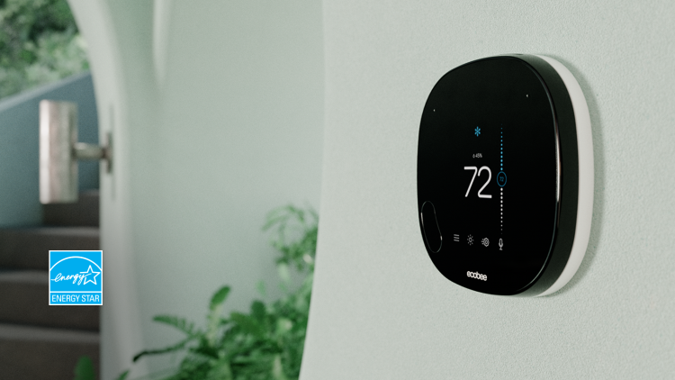 ecobee SmartThermostat with voice control on white wall with ENERGY STAR logo.