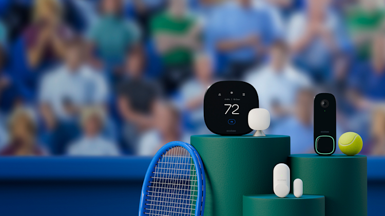 Displaying ecobee's Total Security and Savings Bundle on green pedestals with a yellow tennis ball and blue tennis racket. The background is a blurred shot of a tennis court with a crowd.