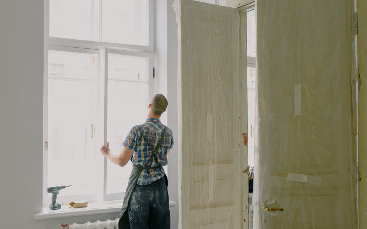 Image of someone replacing a window.