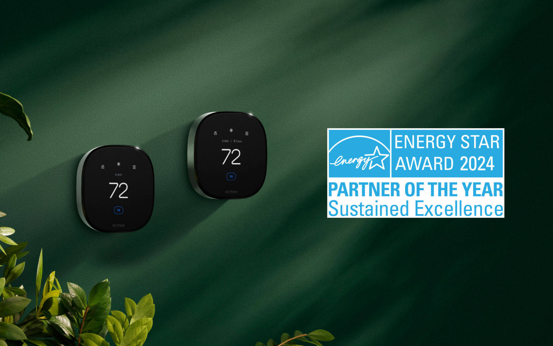Two ecobee smart thermostats against green wall with ENERGY STAR Award 2024 Partner of the Year badge for Sustained Excellence.