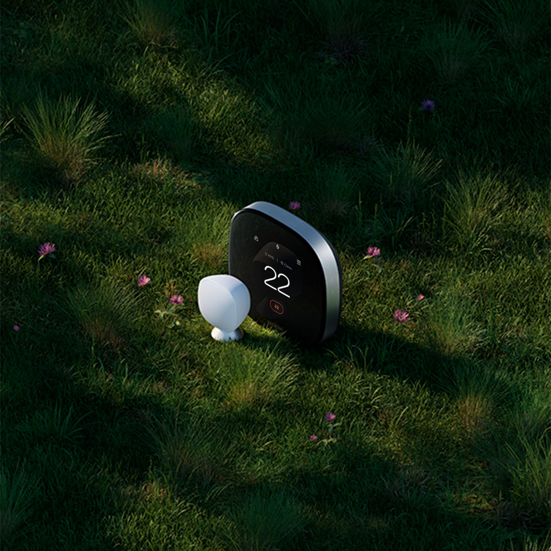 ecobee Smart Thermostat premium with smartsensor on a bed of grass.