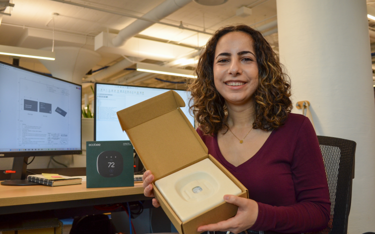  ecobee Product Engineer, Saba Sadegh-pour, Holding Product Packaging in ecobee Office. 