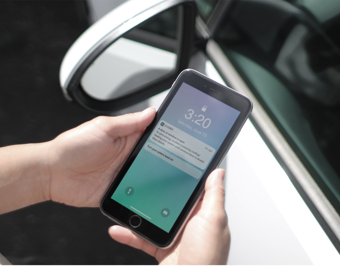 A phone screen shows a notification from ecobee.