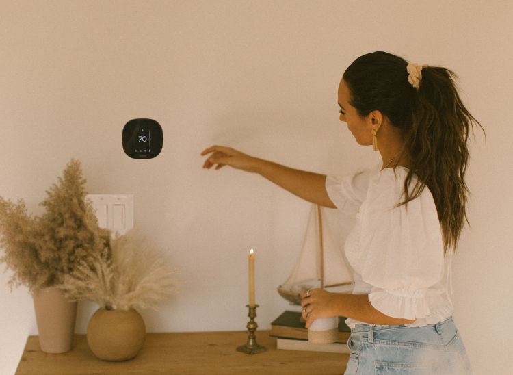 Elana moving toward smart thermostat to change temperature on device. 