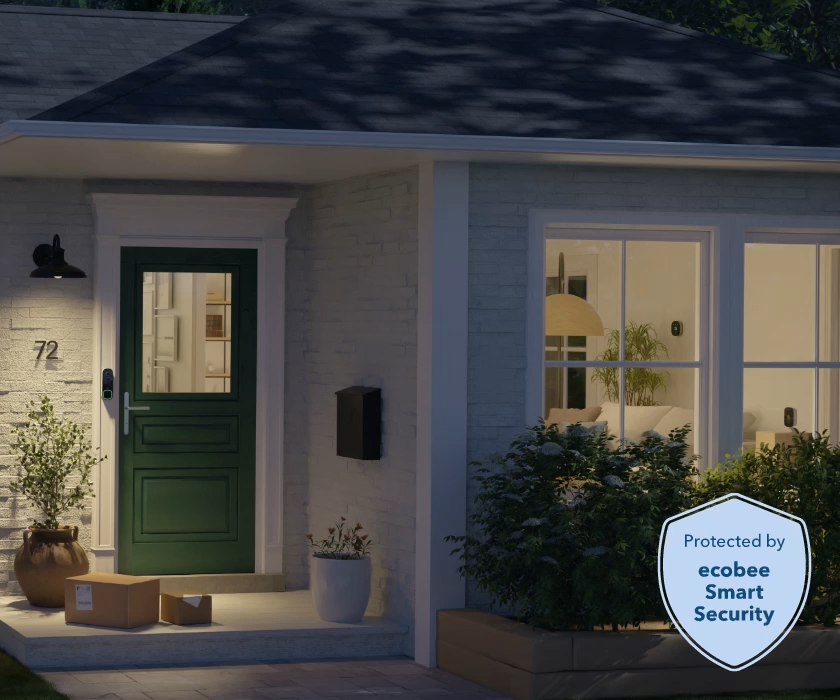 Front porch of a home with packages at night. ecobee Smart Doorbell Camera is visible. 