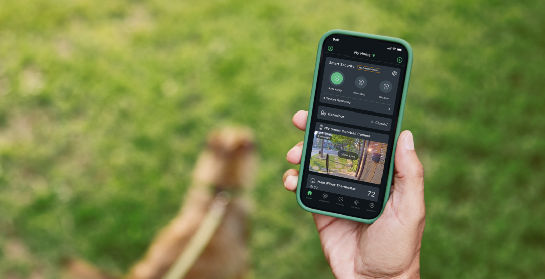 Hand holding a phone showing the ecobee app