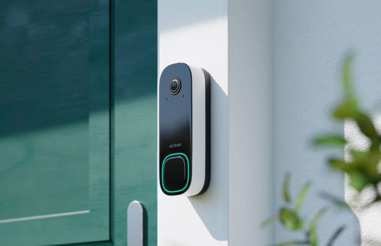 ecobee Smart Doorbell Camera against white door frame in the daytime.