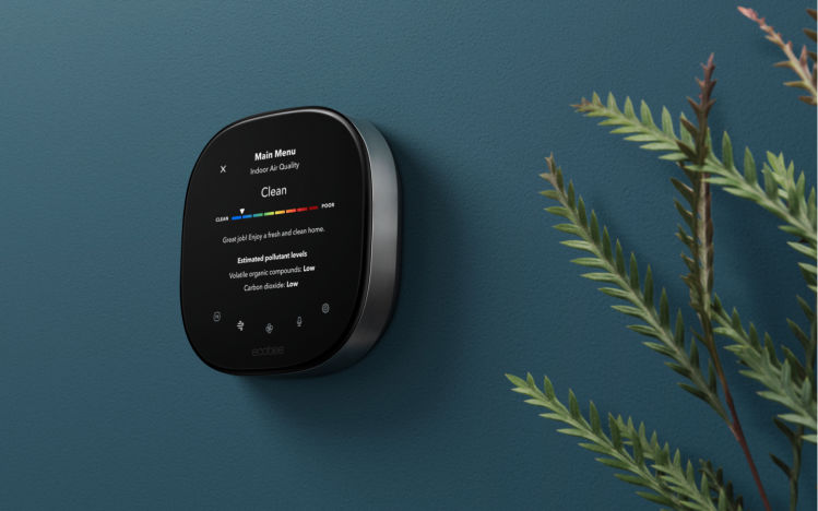 Smart Thermostat Premium showing the air quality monitor feature on-screen. 