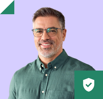Headshot of man with glasses in a green button down shirt.