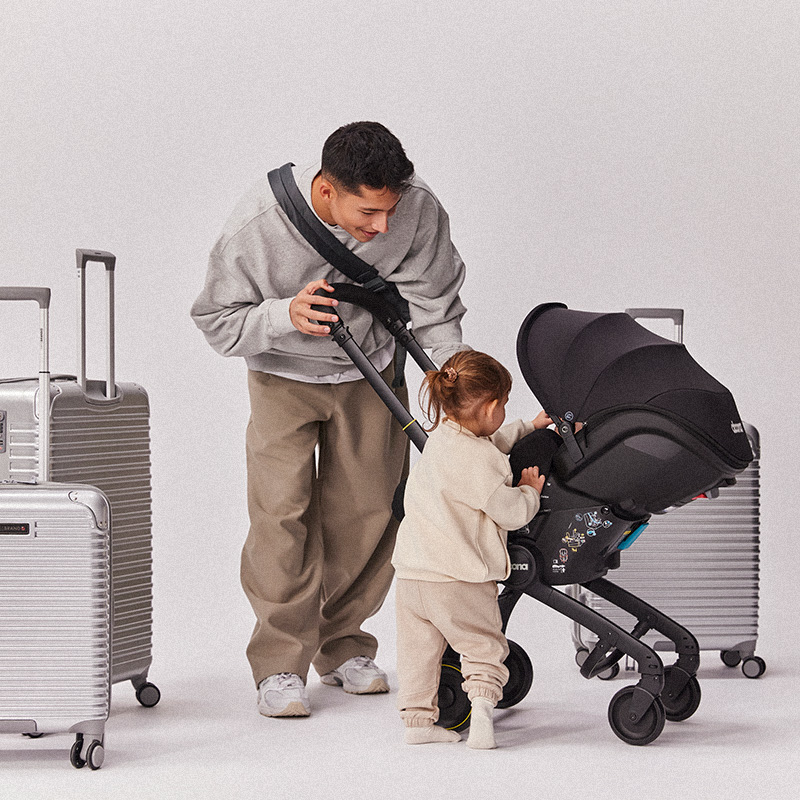 Doona car seat installed on airplane seat