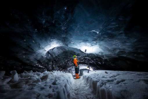 Admiring the Inside of Askur Ice Cave, South Coast Iceland