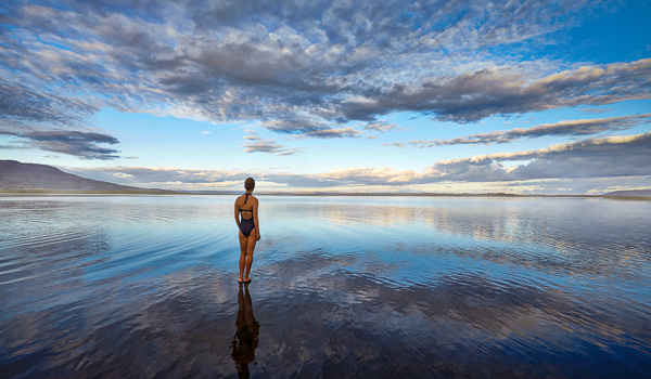 Summer evening at Laugarvatn Fontana with serene water reflections.