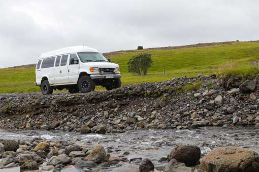 Off-Road Van Crossing Rocky Terrain on Iceland’s South Coast